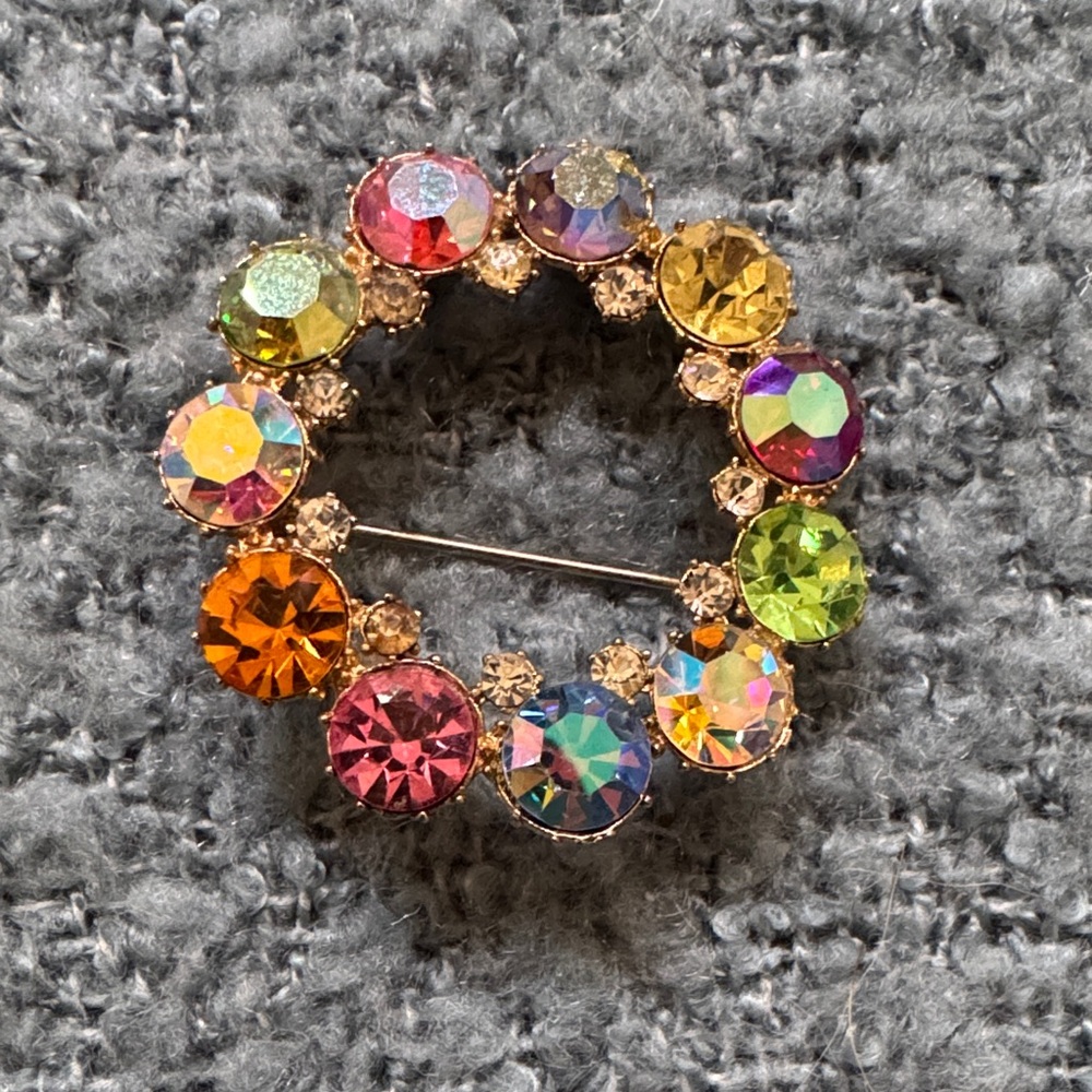 Vintage wreath brooch with aurora borealis crystal rhinestones.